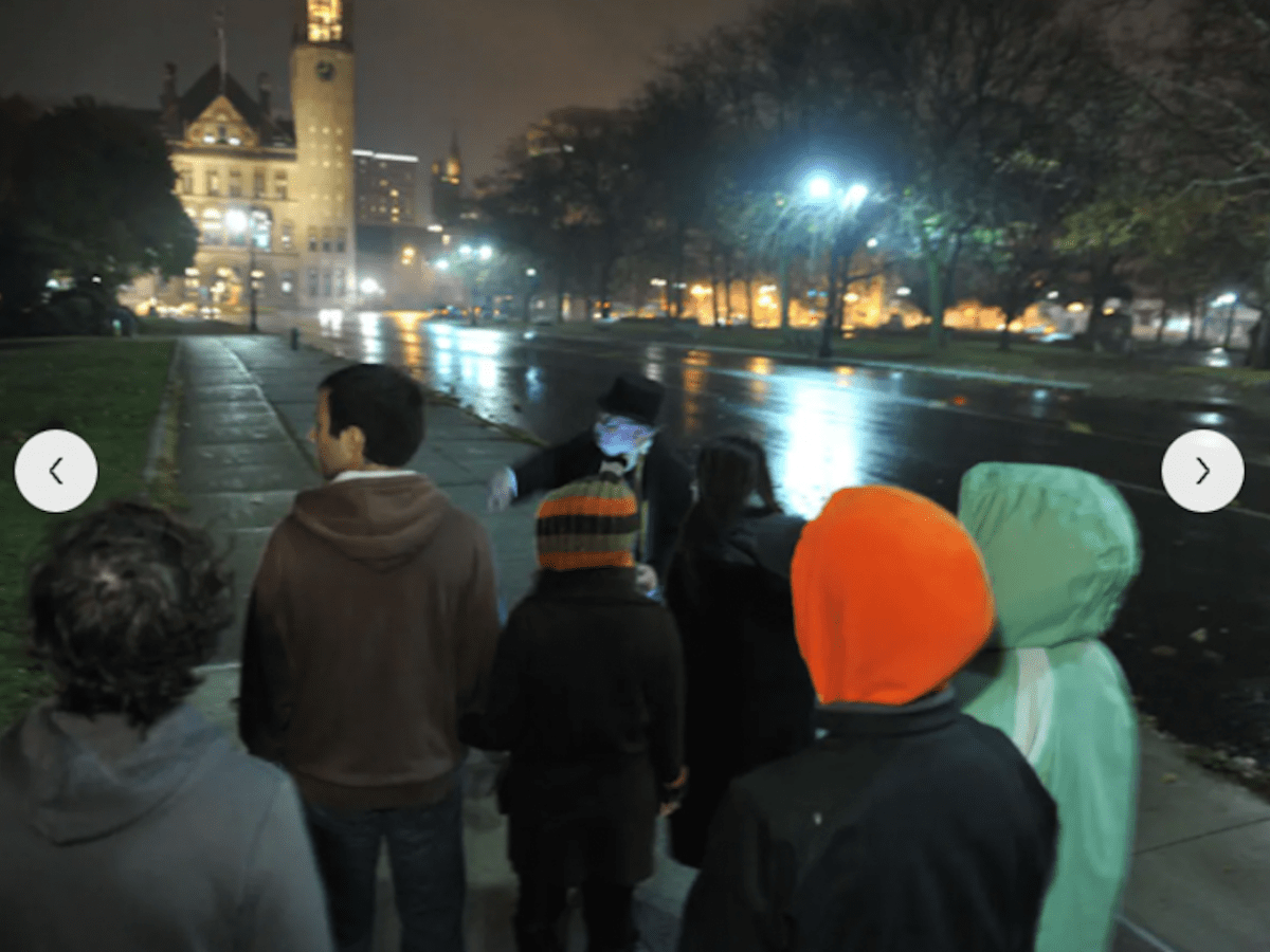 a group of people standing in front of a crowd