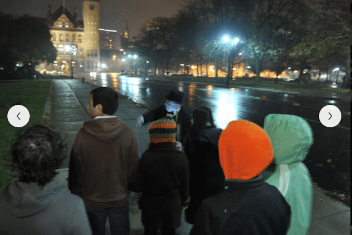 a group of people standing in front of a crowd